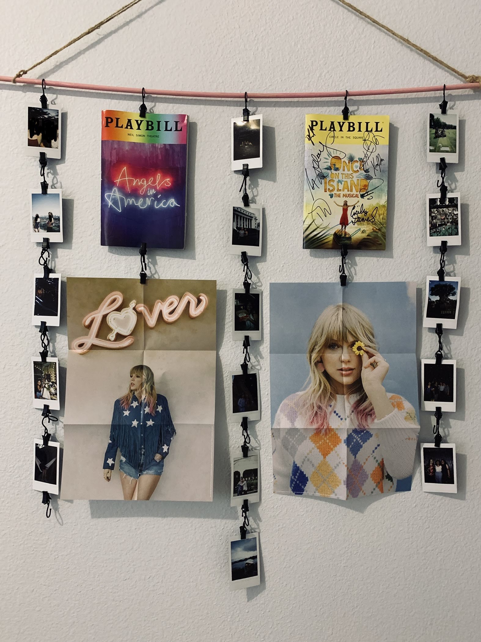 A wall by my door with my polaroids, playbills, and the posters from Lover Deluxe Volume 3 & 4. (Photo by DefiningAngelika)
